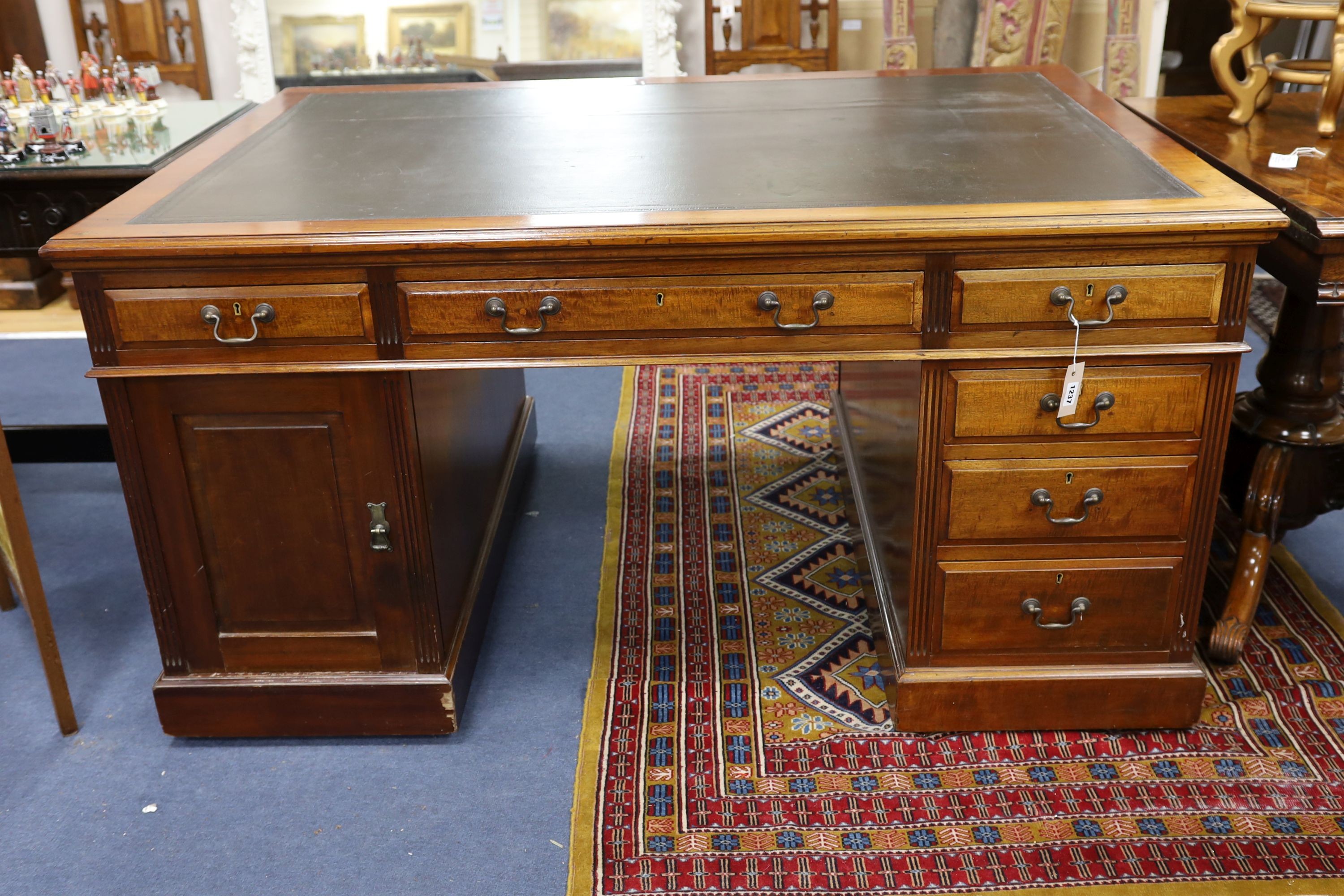 A Victorian mahogany pedestal partner's desk by Maple & Co., length 152cm, depth 105cm, height 78cm